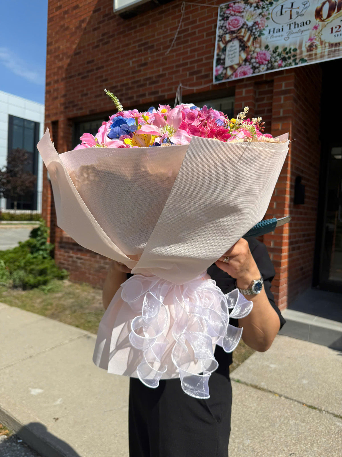 Mixed flower bouquet with white wrapping paper