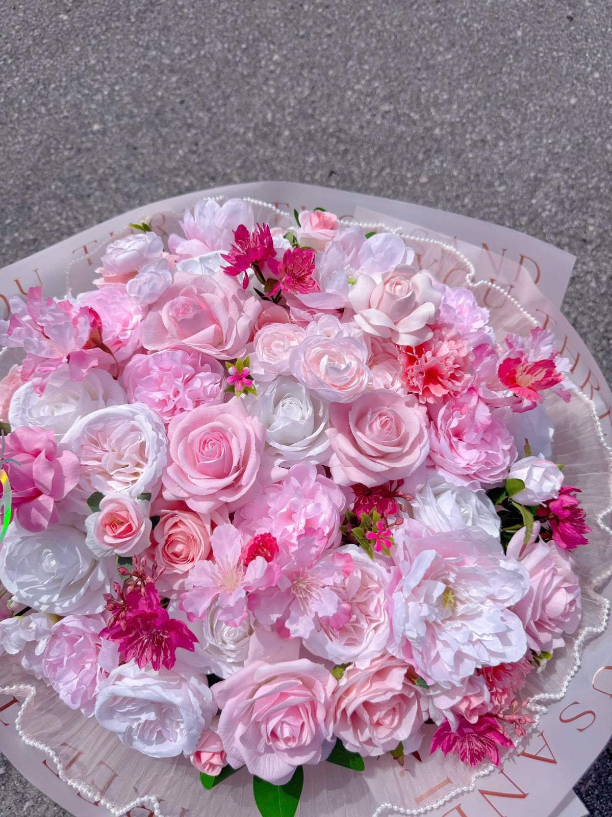 Silk flowers mixed with realistic silicone roses