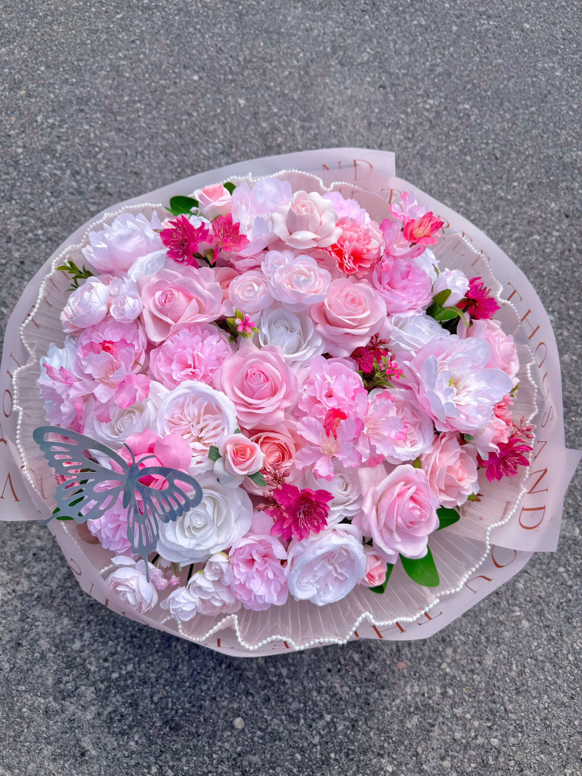 Silk flowers mixed with realistic silicone roses