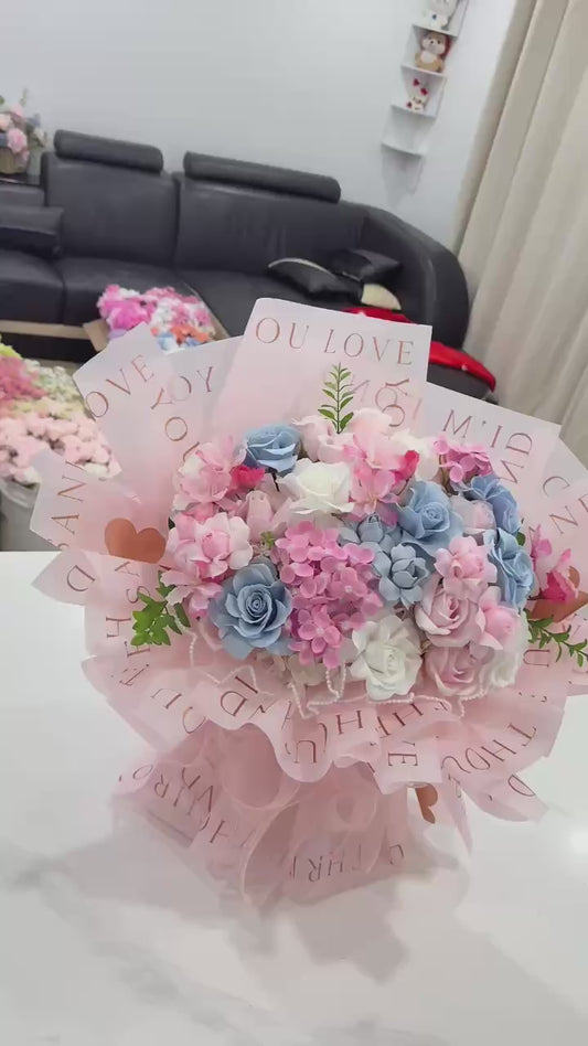 Pink & blue wax flowers in a beautiful fan-shaped arrangement 💗💙💐