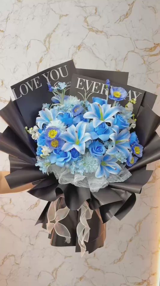 Blue flowers wrapped in black paper with a bold color combination