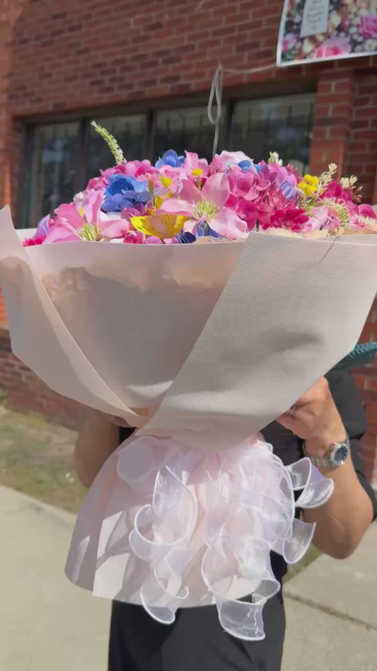 Mixed flower bouquet with white wrapping paper